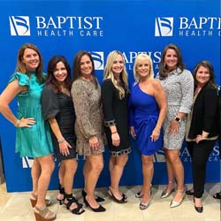 Women smiling in a group photo - Executive group.